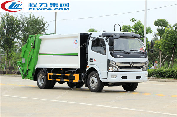 國六東風(fēng)凱普特壓縮垃圾車交付煙臺某鄉(xiāng)村居委會